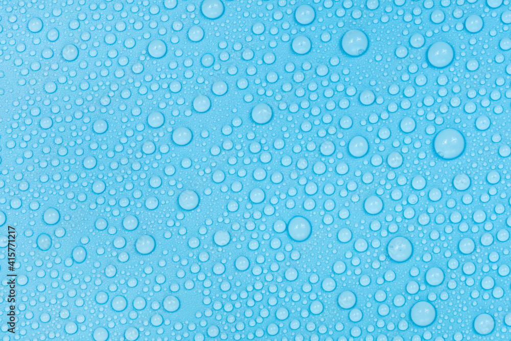 Water drops on blue background texture. Backdrop glass covered with drops of water. bubbles in water Water drops on blue background texture. Backdrop glass covered with drops of water. bubbles in water