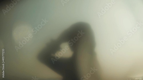 Wallpaper Mural a Girl with full hijab wear poses over the transparant plastic at the beach, fluttering in wind. Blurry concept. Concept of femininity, tenderness, freedom. Torontodigital.ca