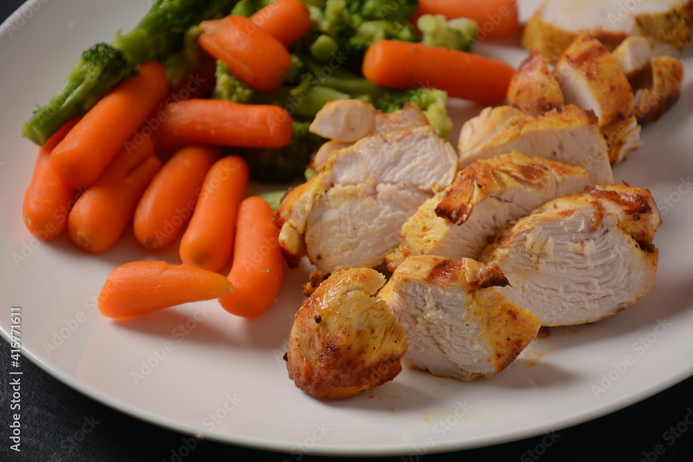 Grilled chicken fillet and vegetables broccoli and carrots boiled Grilled chicken fillet and vegetables broccoli and carrots boiled