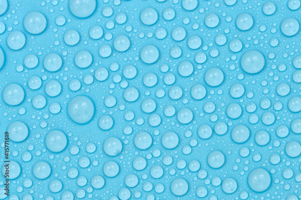 Water drops on blue background texture. Backdrop glass covered with drops of water. bubbles in water Water drops on blue background texture. Backdrop glass covered with drops of water. bubbles in water
