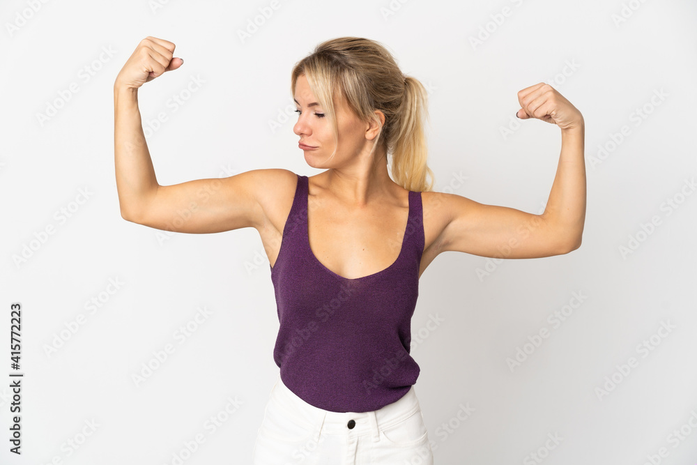 Young Russian woman isolated on white background doing strong gesture Young Russian woman isolated on white background doing strong gesture