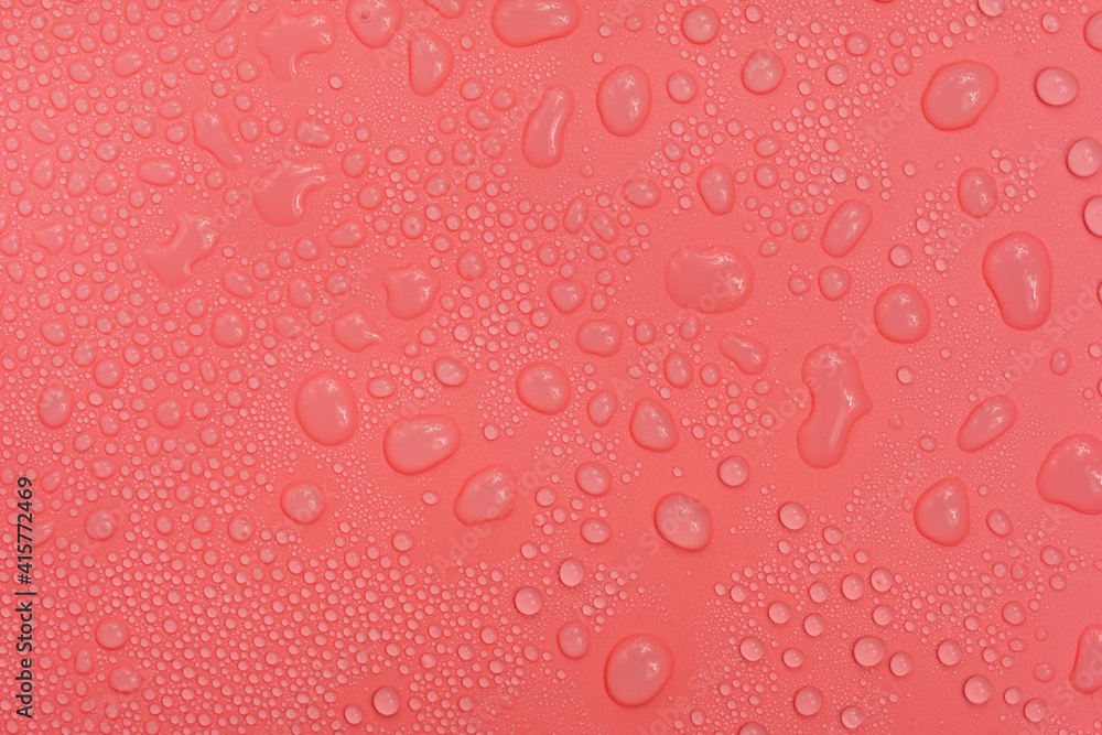 Water drops on red background texture. backdrop glass covered with drops of water. bubbles in water Water drops on red background texture. backdrop glass covered with drops of water. bubbles in water