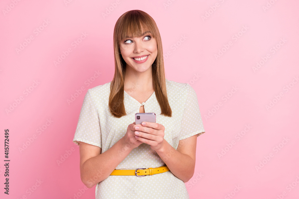 Portrait of attractive cheerful curious girl using gadget creating browsing media smm app 5g isolated over pink pastel color background Portrait of attractive cheerful curious girl using gadget creating browsing media smm app 5g isolated over pink pastel color background