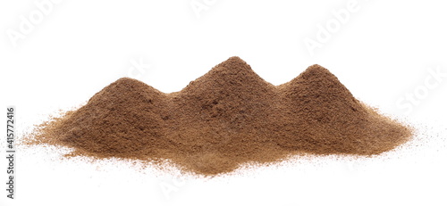 Cinnamon powder pile isolated on white background