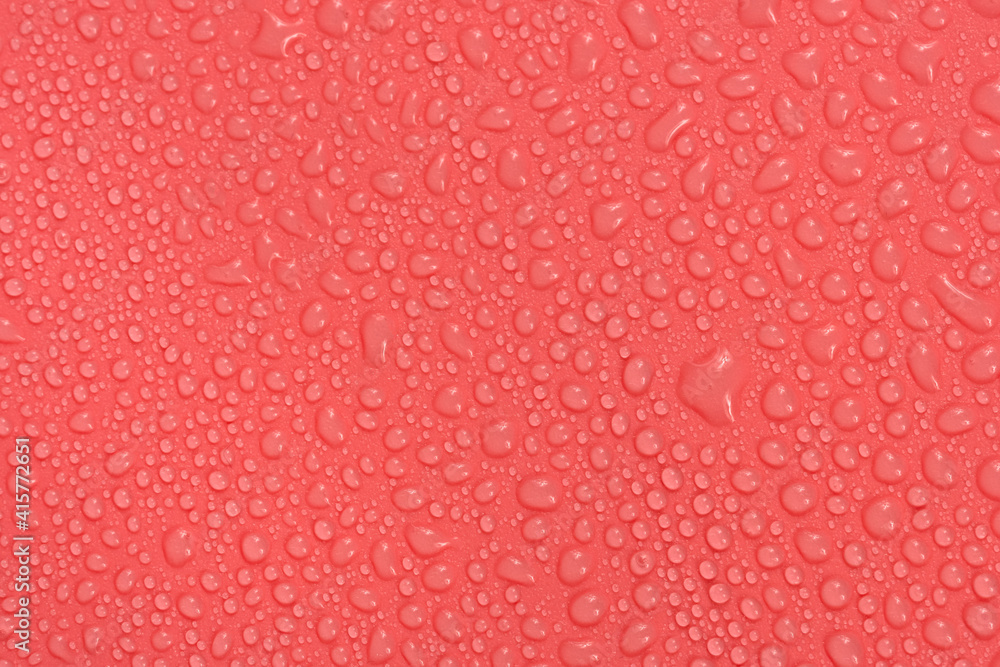 Water drops on red background texture. backdrop glass covered with drops of water. bubbles in water Water drops on red background texture. backdrop glass covered with drops of water. bubbles in water