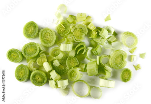 Chopped leek slices pile isolated on white background, top view