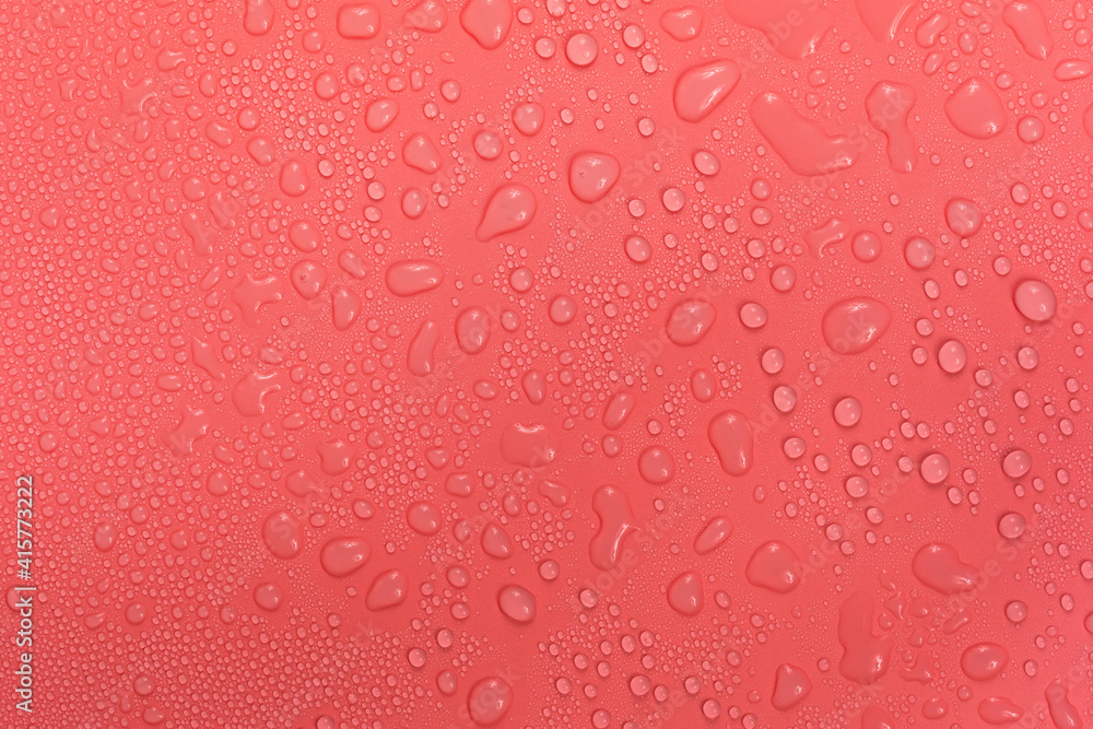 Water drops on red background texture. backdrop glass covered with drops of water. bubbles in water Water drops on red background texture. backdrop glass covered with drops of water. bubbles in water
