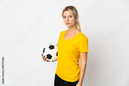 Young Russian woman isolated on white background with soccer ball © luismolinero