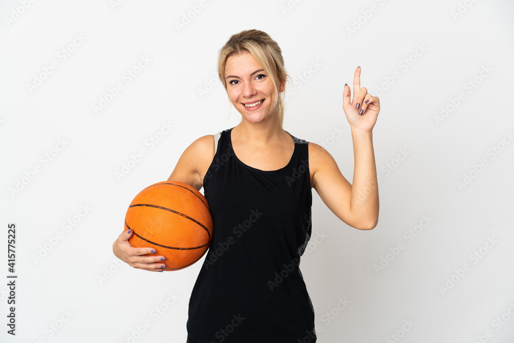 Young Russian woman playing basketball isolated on white background pointing up a great idea Young Russian woman playing basketball isolated on white background pointing up a great idea
