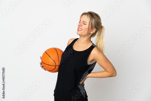 Young Russian woman playing basketball isolated on white background suffering from backache for having made an effort