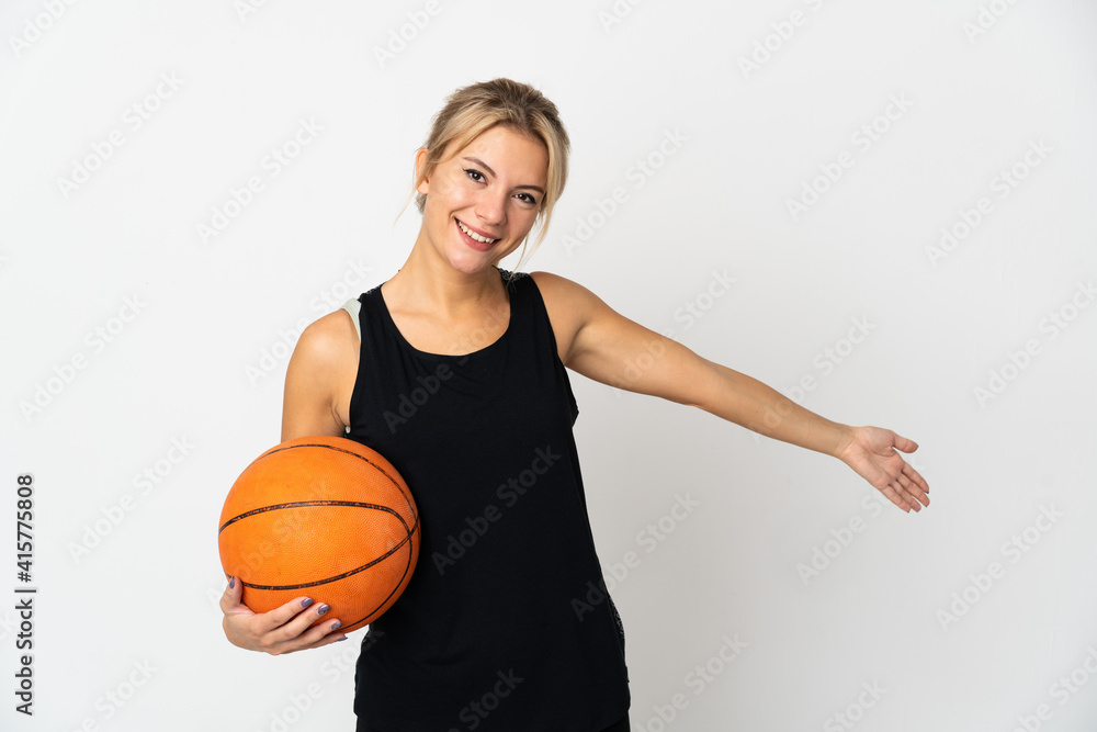 Young Russian woman playing basketball isolated on white background extending hands to the side for inviting to come