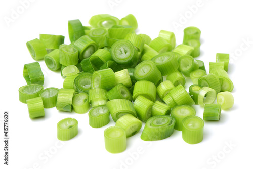chopped green onions on white background