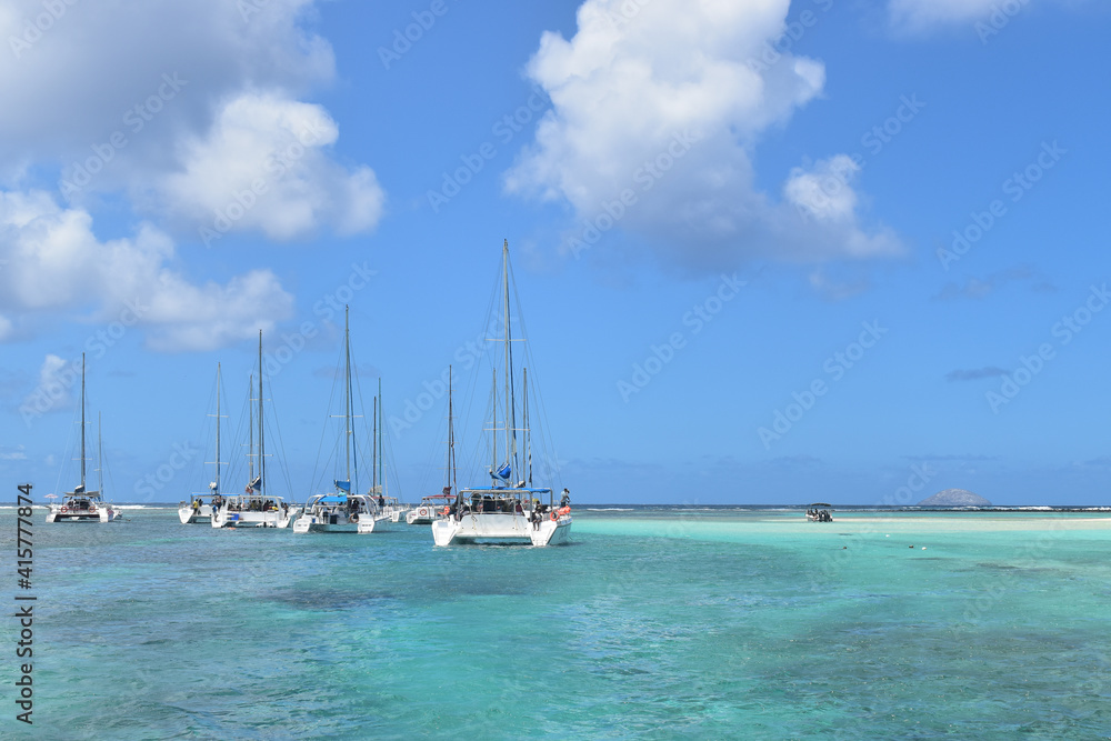 Mauritius dated 20 Feb 2021. Catamarans moored between the idyllic Gabriel island and the Flat island. Mauritius a paradise in the middle of the Indian ocean.