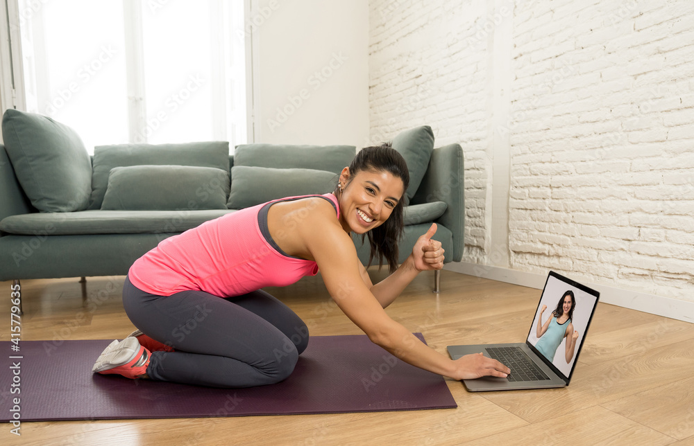 Online fitness. People on laptop in online fitness training working out with virtual personal coach Online fitness. People on laptop in online fitness training working out with virtual personal coach