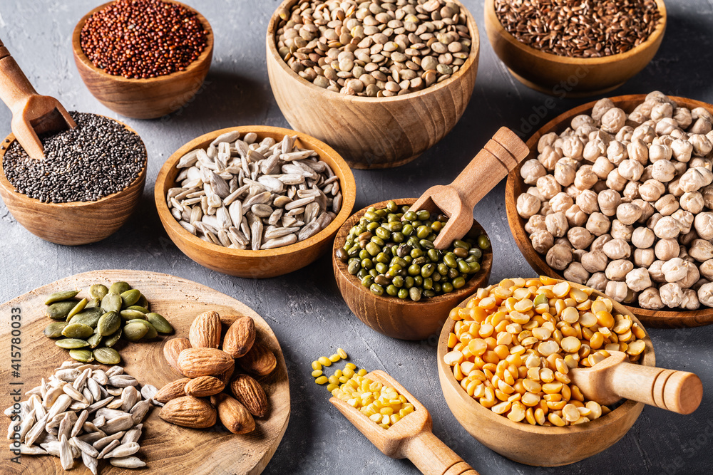 Assortment of beans, legumes on grey concrete background. Assortment of beans, legumes on grey concrete background.
