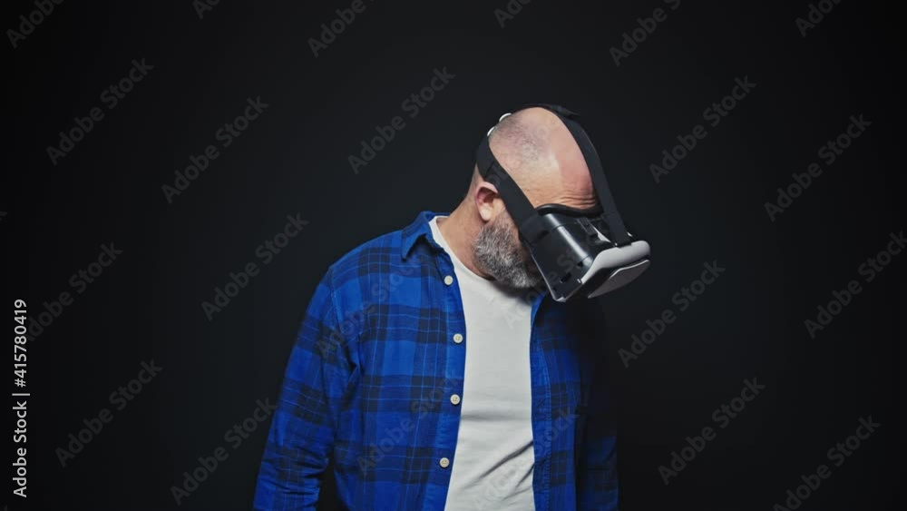 Caucasian man using VR goggles Caucasian man using VR goggles