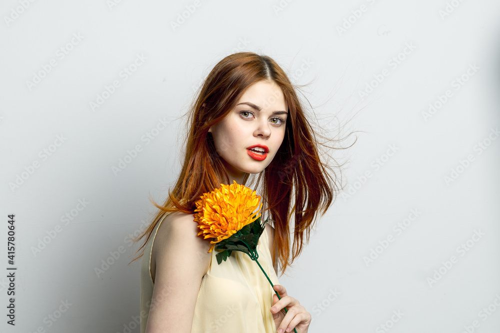 smiling woman with big yellow flower in hands emotions joy studio smiling woman with big yellow flower in hands emotions joy studio