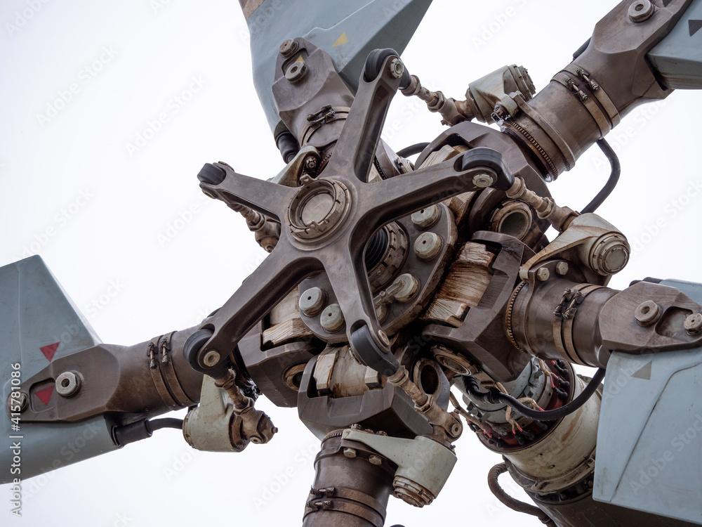 Fototapeta premium The mechanism of screws military helicopter on the background of blue sky, a close-up