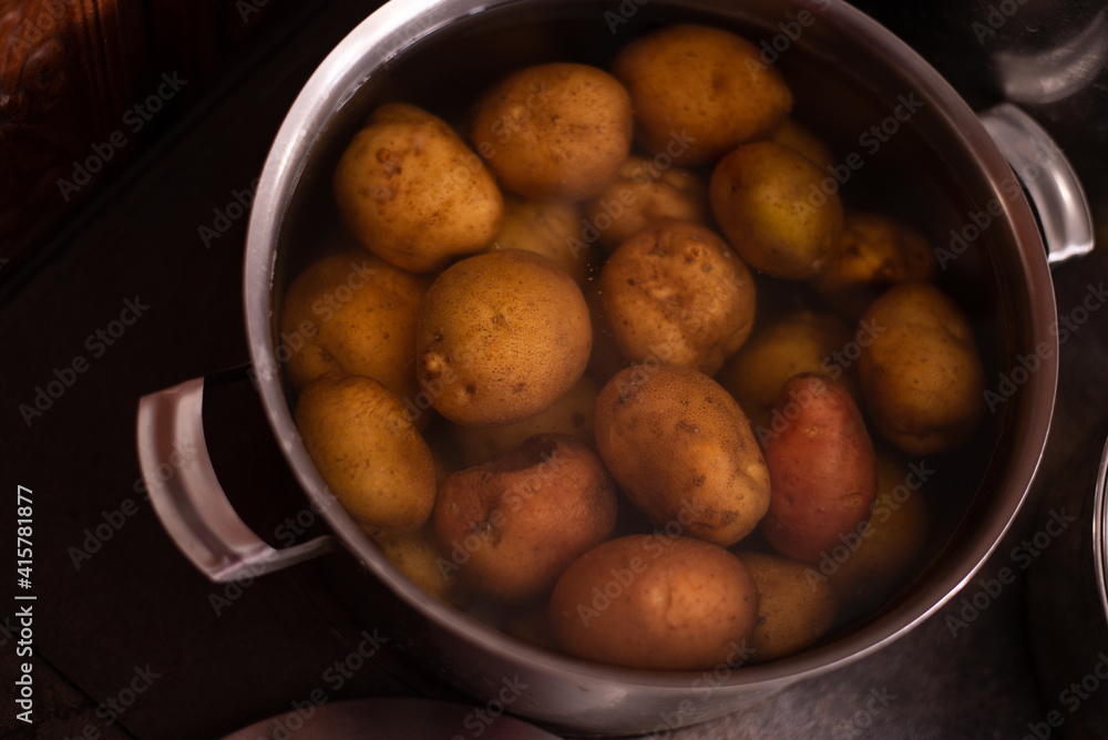 a pot of boiled potatoes at home on the stove a pot of boiled potatoes at home on the stove