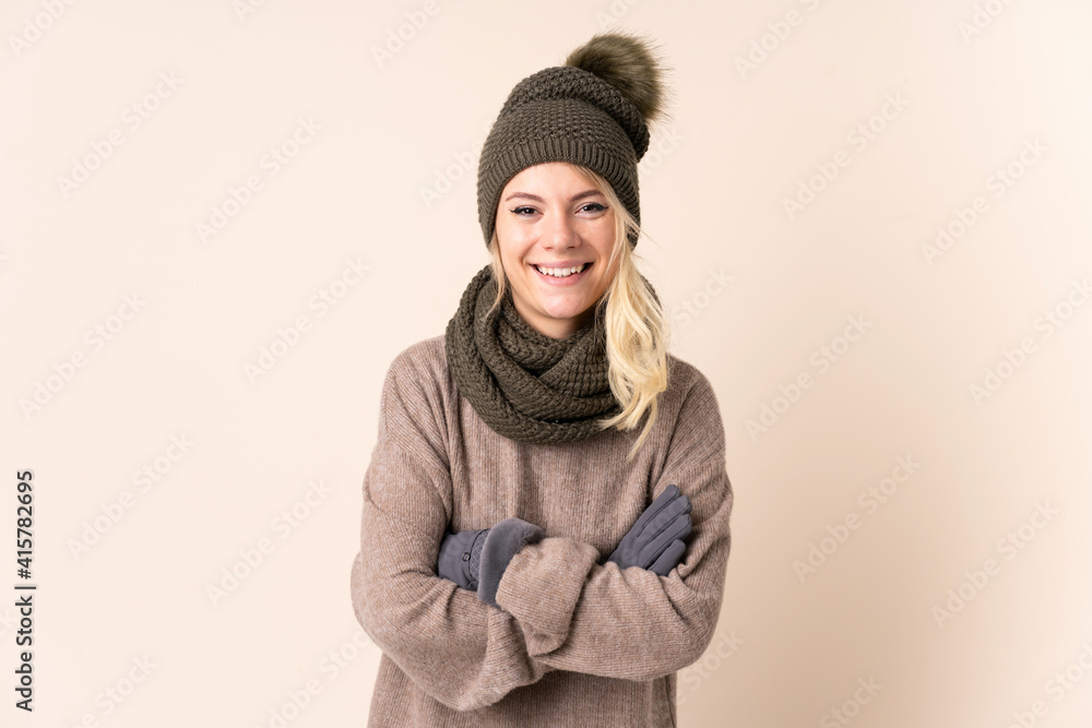Young woman with winter hat over isolated background laughing Young woman with winter hat over isolated background laughing