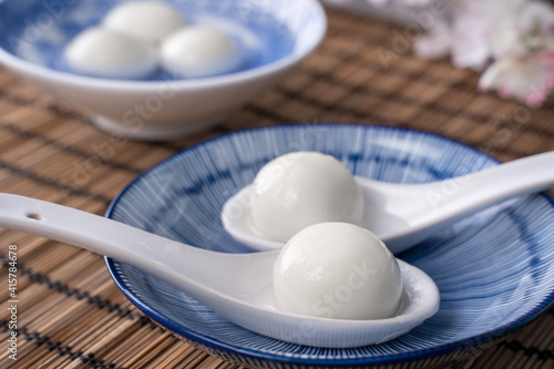 Close up of yuanxiao tangyuan in a bowl on gray table  food for Chinese Lantern Yuanxiao Festival.
