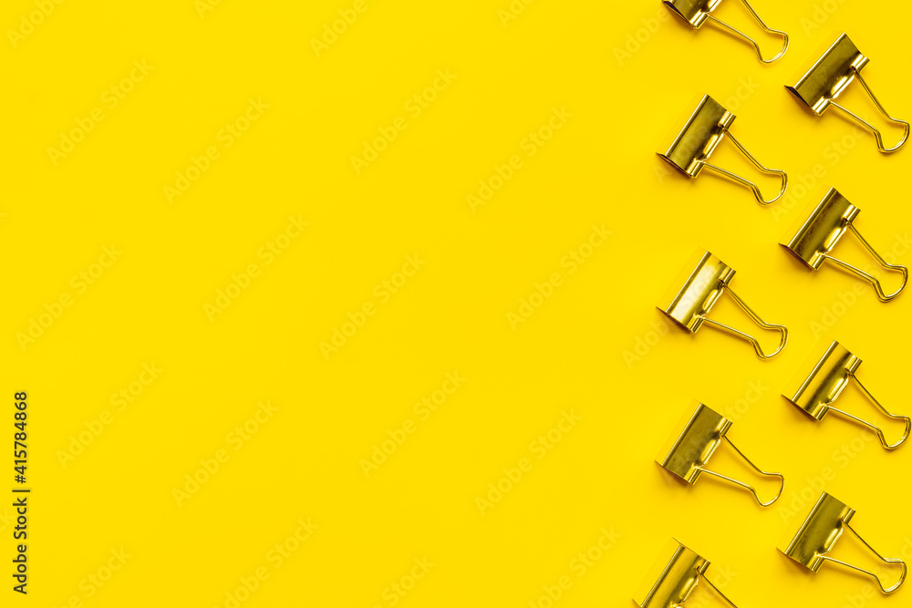 Flat lay of paper binder clips, office supplies pattern Flat lay of paper binder clips, office supplies pattern