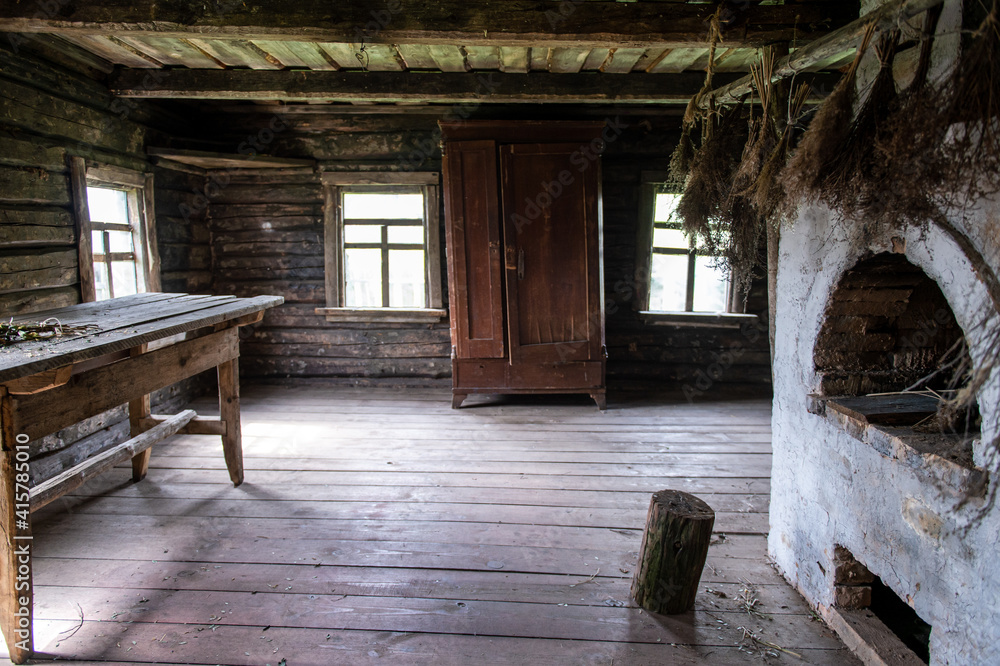 Interior of wooden countryside old house with rustic oven