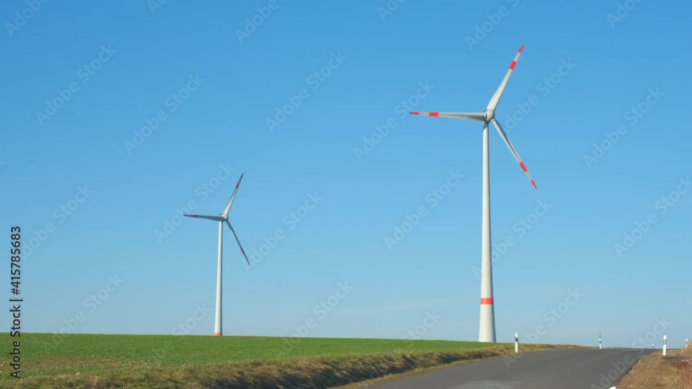 Wind Turbines Turning on a Clear Day Blue Skies Germany Wind Turbines Turning on a Clear Day Blue Skies Germany