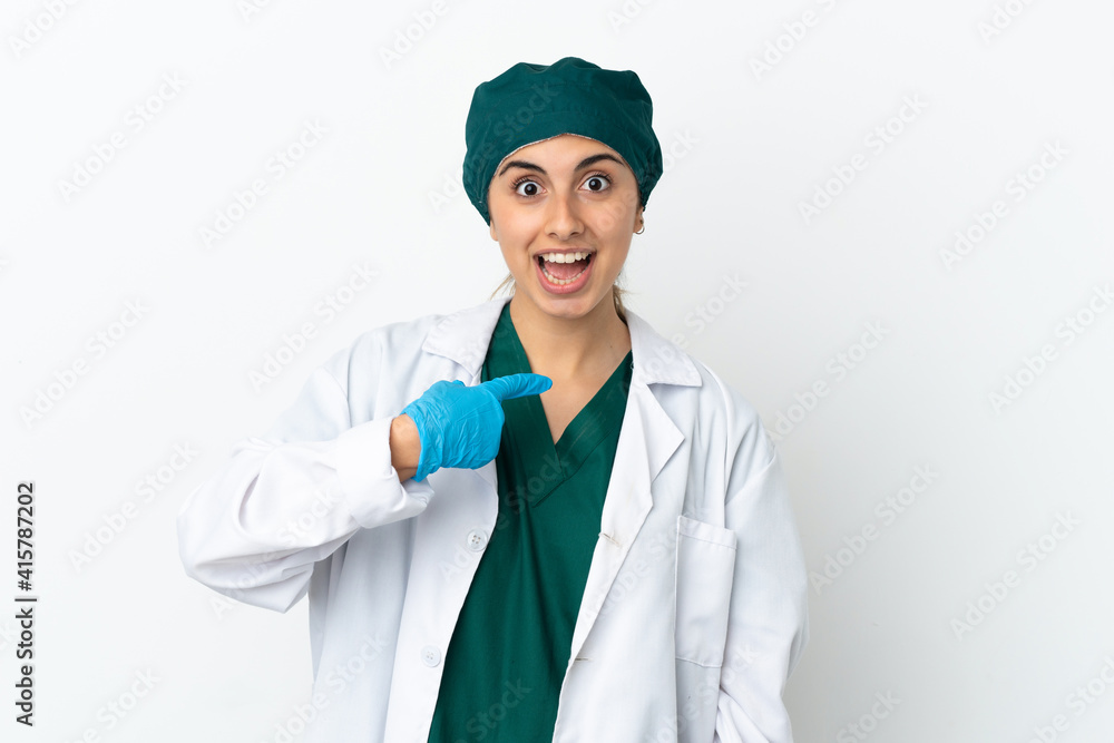 Surgeon caucasian woman isolated on white background with surprise facial expression Surgeon caucasian woman isolated on white background with surprise facial expression