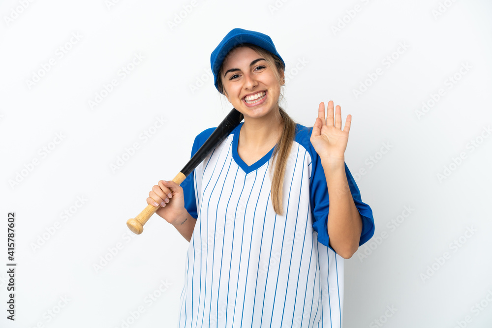 Young caucasian woman playing baseball isolated on white background saluting with hand with happy expression