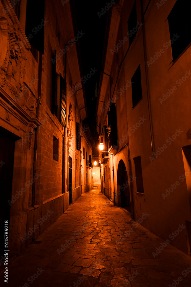 Narrow street in old town at night