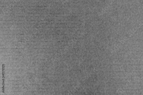 Background cardboard, cardboard packaging close-up on black and white image.