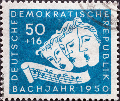 GERMANY, DDR - CIRCA 1950: a postage stamp from Germany, GDR showing Three singing masks, excerpt with the sequence B-A-C-H. Bach year 1950 (200th anniversary of Johann Sebastian Bach's death)