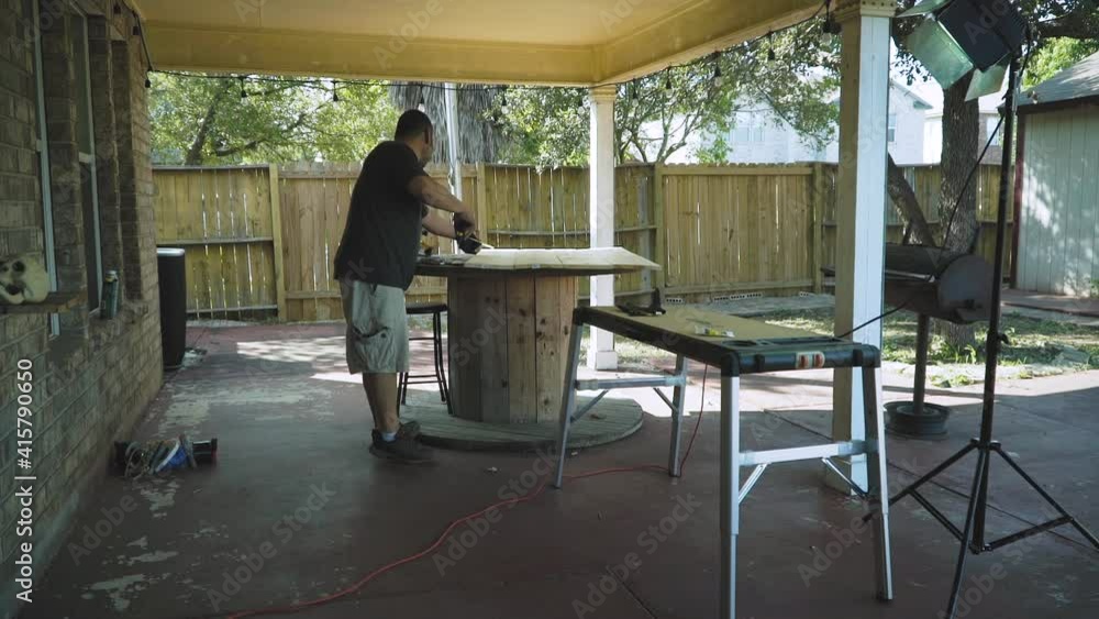 Carpenter Assembling and measuring Wood Table Carpenter Assembling and measuring Wood Table