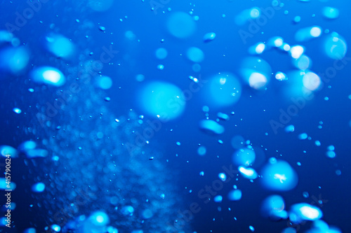 Water bubbles details texture over deep blue background