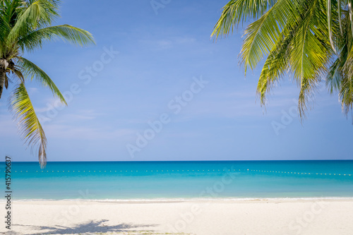 Tropical nature clean beach and white sand in summer with sun light blue sky background.