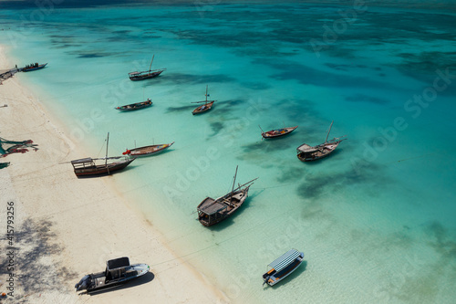 Zanzibar, a fishing village on the exotic coast. Boats drift peacefully in the bay 