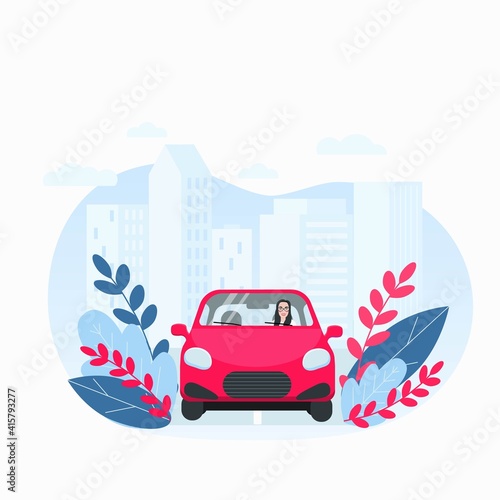 Young woman driving a car in the city