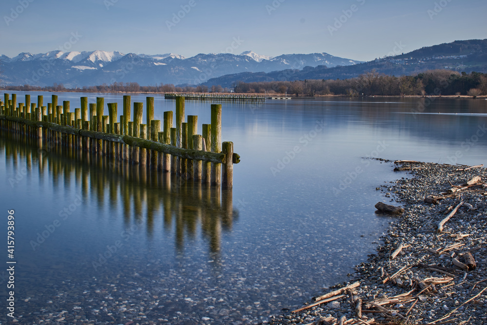 Reflections from wooden piles in the water of Lake Constance