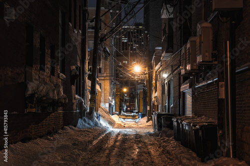 snow covered alley in the night
