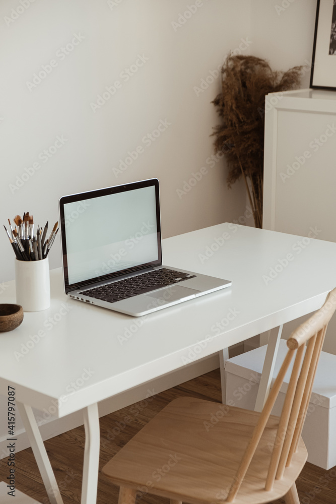 Laptop computer with blank screen on table. Aesthetic minimal office workspace interior design template with mockup copy space. Laptop computer with blank screen on table. Aesthetic minimal office workspace interior design template with mockup copy space.