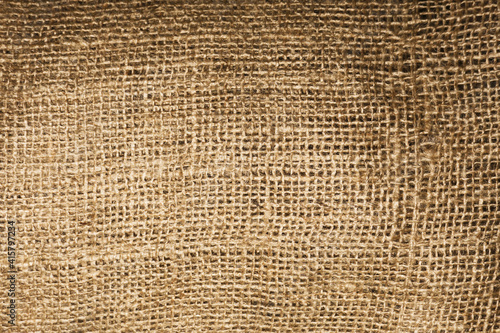Natural brown linen fabric background. Fiber structure texture. Vintage canvas pattern. Rustic decoration pattern. Antique hessian bag textile background.