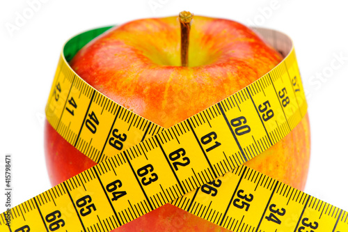 healthy fruit with measuring tape