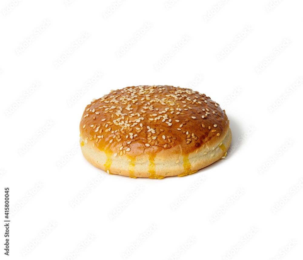 baked round burger bun isolated on white plate baked round burger bun isolated on white plate