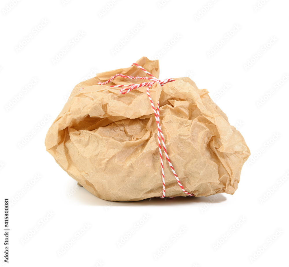 wrapped in brown kraft paper object and tied with rope, packaging on white background wrapped in brown kraft paper object and tied with rope, packaging on white background