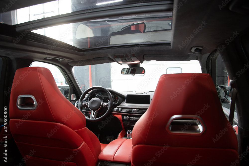 Car detailing series: interior of a luxury car. red seats Car detailing series: interior of a luxury car. red seats