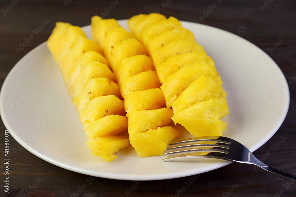 Slices of mouthwatering fresh ripe pineapple in white plate Slices of mouthwatering fresh ripe pineapple in white plate