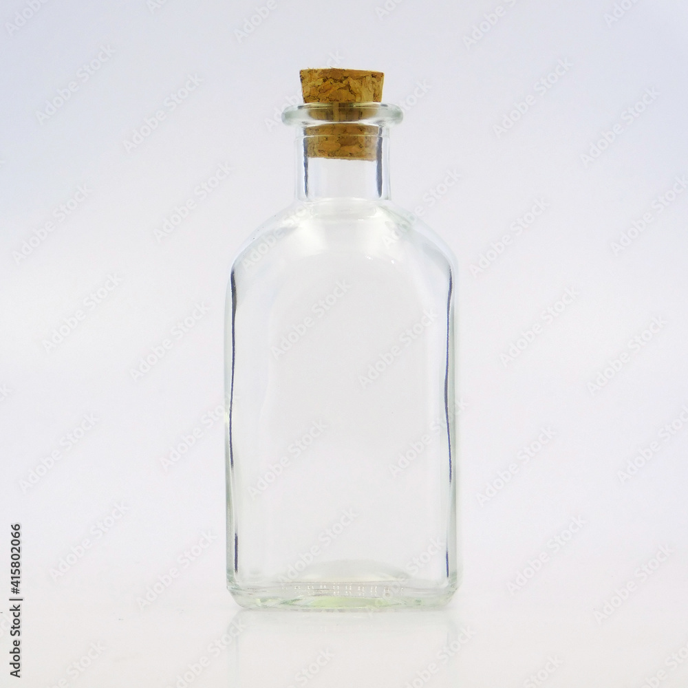 medium glass bottle with cork cap, transparent, sparkly and brilliant, for food, liquids, sauces, grain, condiments, seeds, preserves and candys, also for decoration medium glass bottle with cork cap, transparent, sparkly and brilliant, for food, liquids, sauces, grain, condiments, seeds, preserves and candys, also for decoration