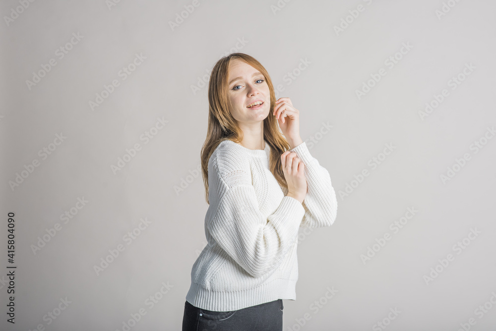 Beautiful young girl on a white background in the studio cute smiling Beautiful young girl on a white background in the studio cute smiling