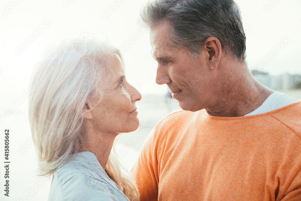 Happy senior couple spending time at the beach. Concepts about love,seniority and people Happy senior couple spending time at the beach. Concepts about love,seniority and people